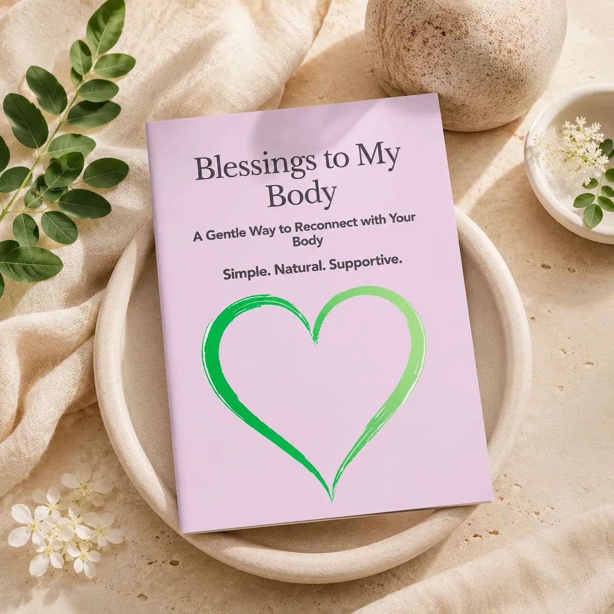 Blessings to My Body card on a neutral stone tray with soft linen, green leaves, and white flowers in a calm natural wellness flat lay.