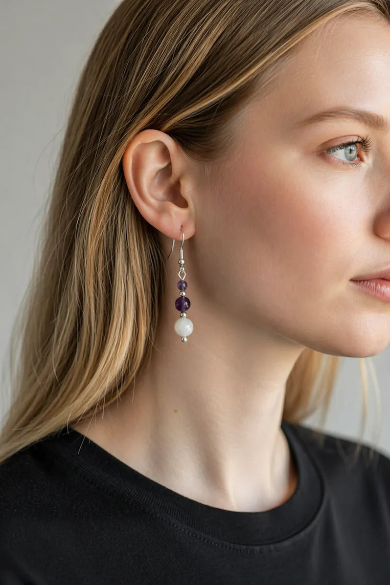 Close-up of a woman wearing soft protection earrings with a neutral background.